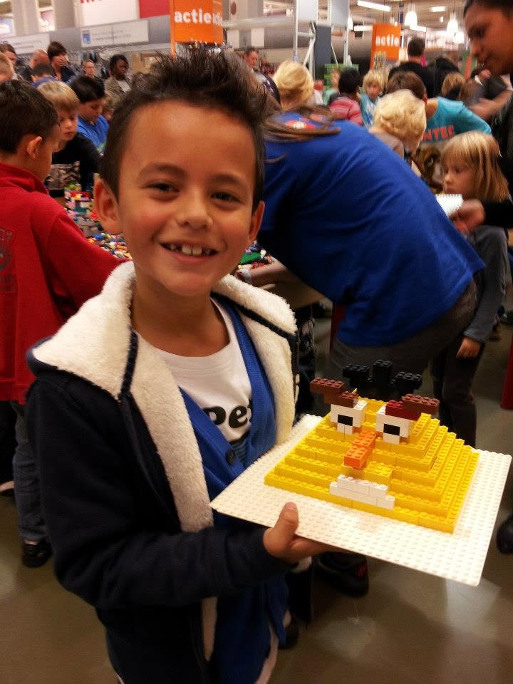 Ramón as a kid, holding a LEGO build